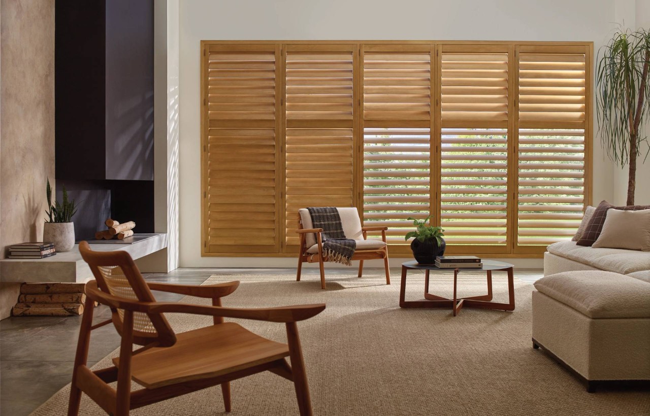 Hunter Douglas wood shutters creating a cohesive interior design in a living room near College Station, TX