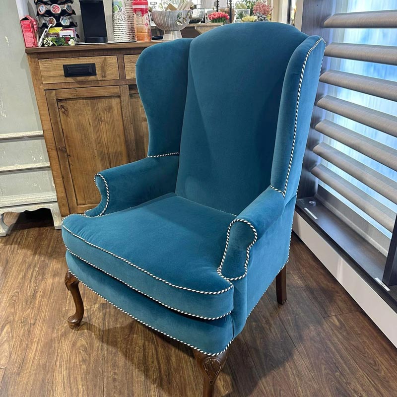 blue upholstered lounge chair